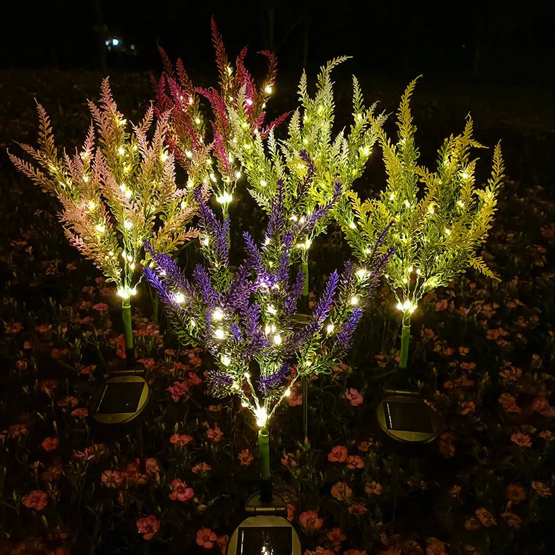 74cm tall solar-powered LED garden light with artificial flower design in lavender colour variations