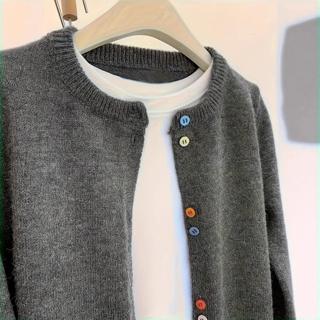 Dark grey women's button-front cardigan sweater on a hanger, showing long sleeves and regular length.