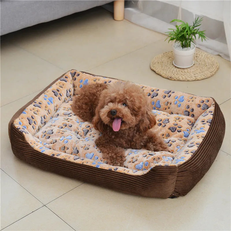 Beige plush dog bed with high bolsters and a removable washable cover for small pets.