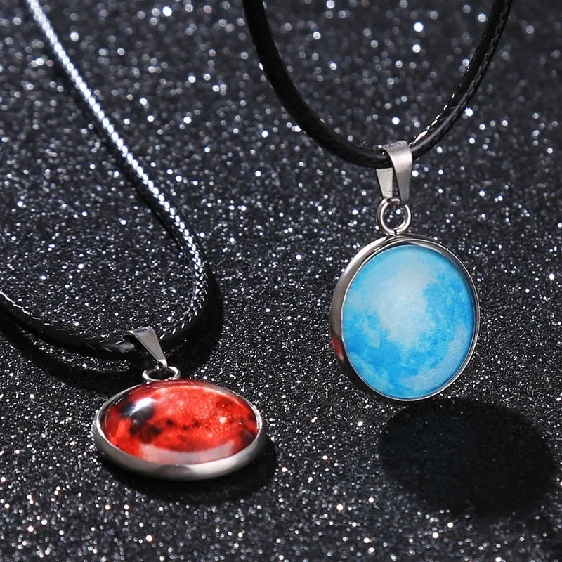 Luminous moon and constellation pendant necklace on a chain with an extension, shown in one of ten possible colours.