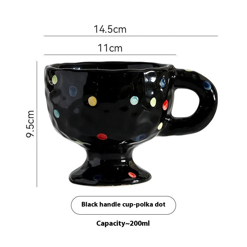 Hand-pinched irregular ceramic mug in a solid colour, shown from the side to display its unique shape.