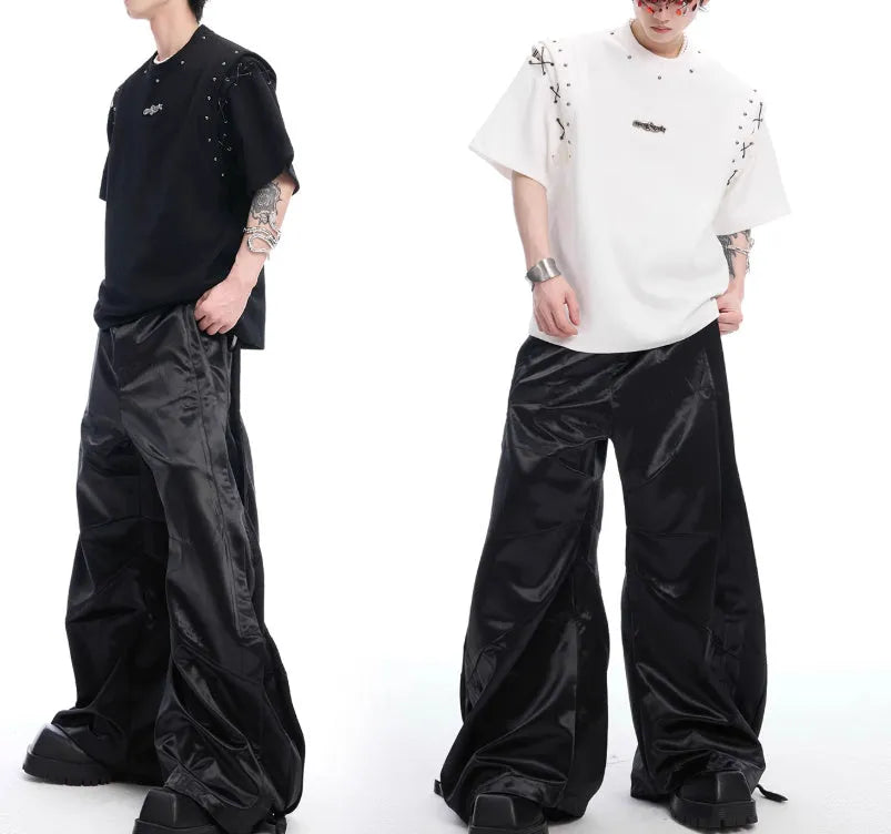 Black short sleeve t-shirt with side lace-up cutout detail on white background