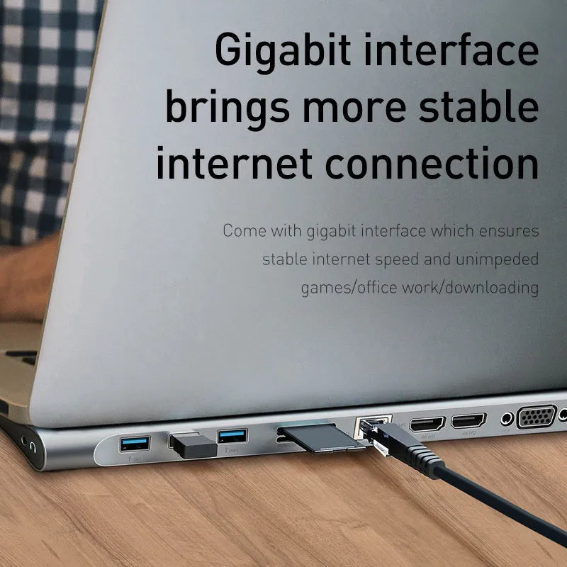 Grey aluminium ten-port laptop docking station with cooling bracket showing HDMI, VGA, and USB ports