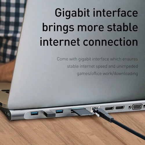 Grey aluminium ten-port laptop docking station with cooling bracket showing HDMI, VGA, and USB ports