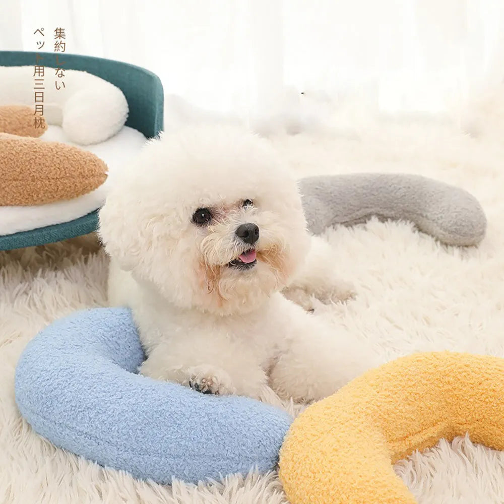 Blue U-shaped cat pillow with an adjustable fabric collar for neck support.