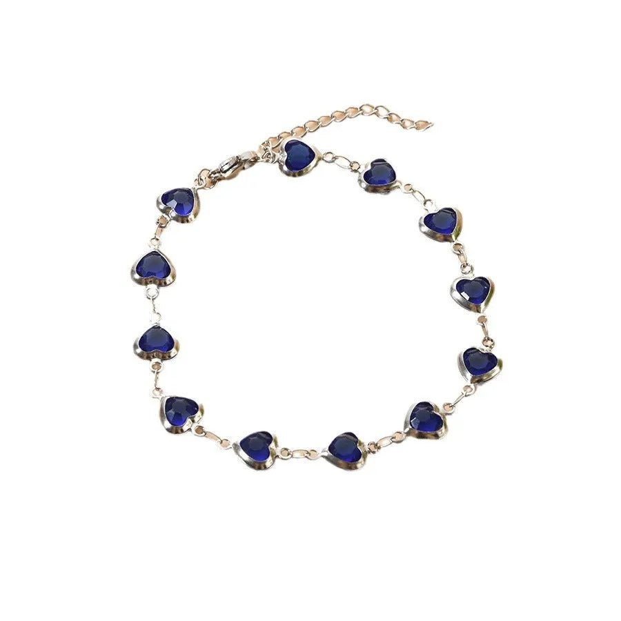 Devil's Eye geometric heart bracelet in stainless steel, shown in colourful, blue, green, or red electroplated finish