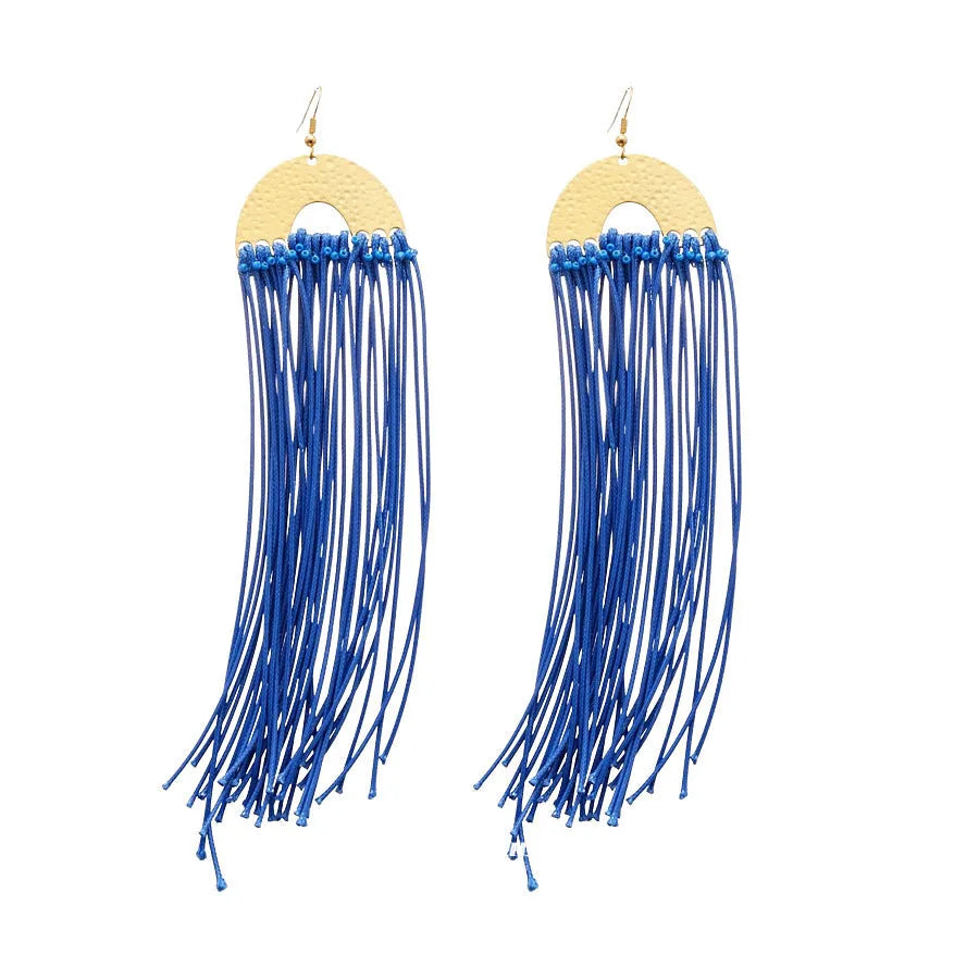 Geometric women's earrings with round blue cloth accents and silver metal details on a white background.