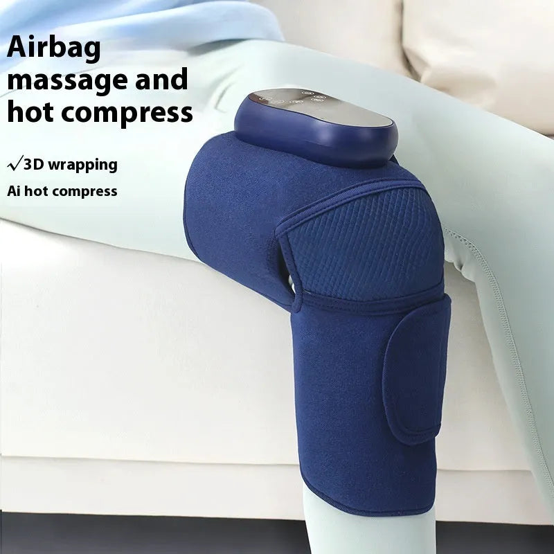 Blue self-heating knee massager showing airbag compression design around knee joint