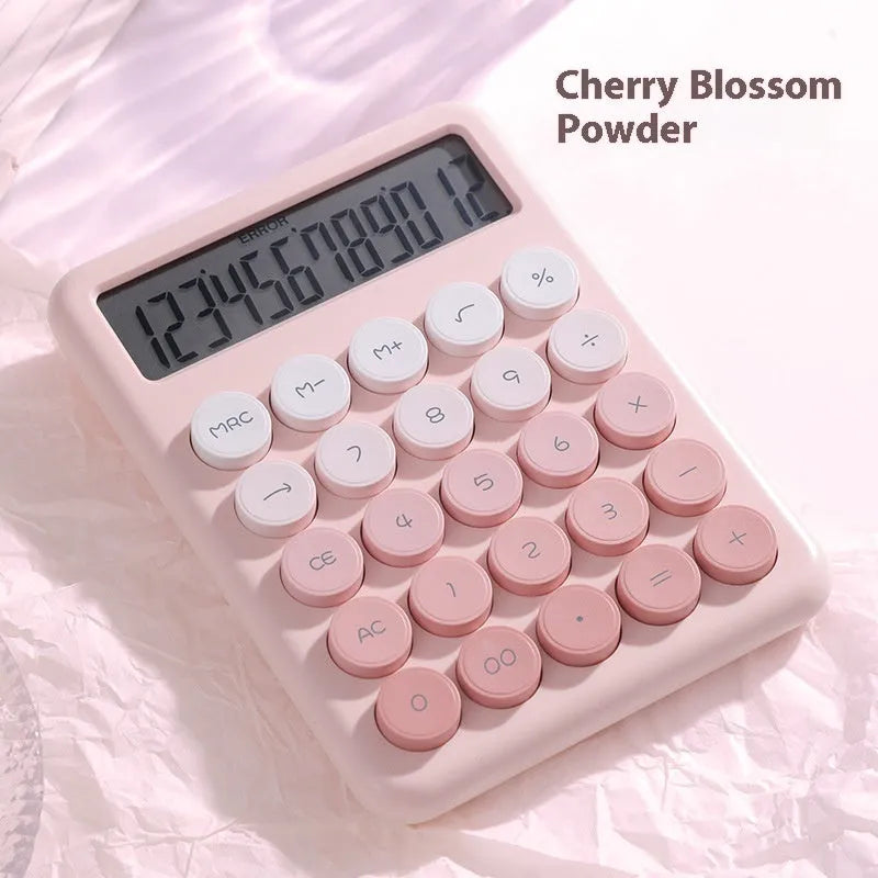 Dopamine gradient colour desk calculator in violet, pink, blue, or mint green on a desk.