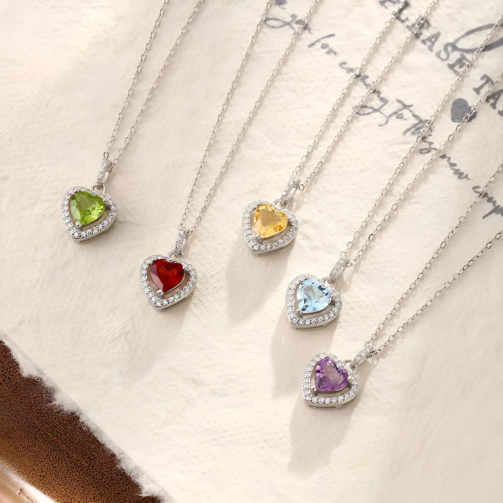 Women's sterling silver necklace with heart-shaped natural gemstone pendant on cross chain