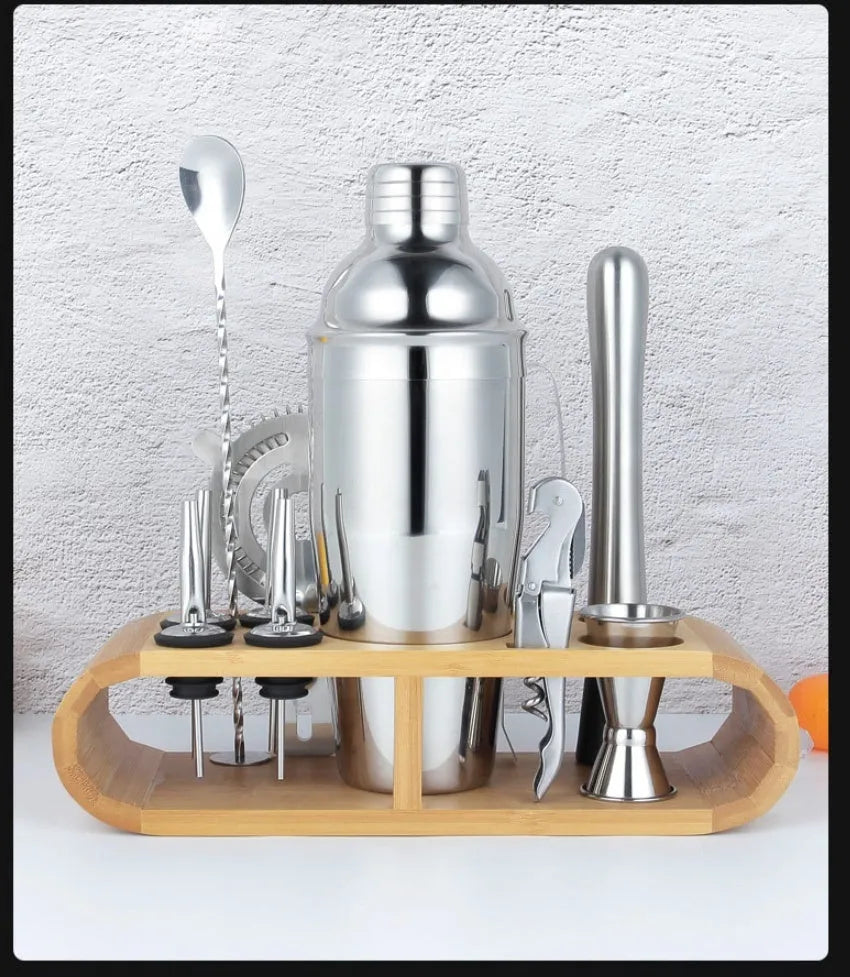 23-piece stainless steel cocktail bar set with acrylic European style mixers laid out on a table.