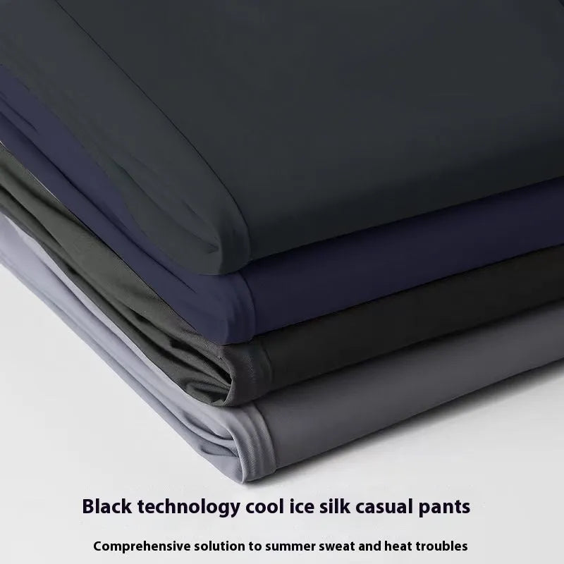 Men's loose-fit ice silk trousers in black, shown flat, highlighting the elastic waistband and straight leg.