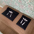 Black and white quilted nylon laptop bag for women with a ballet bow and striped pattern.