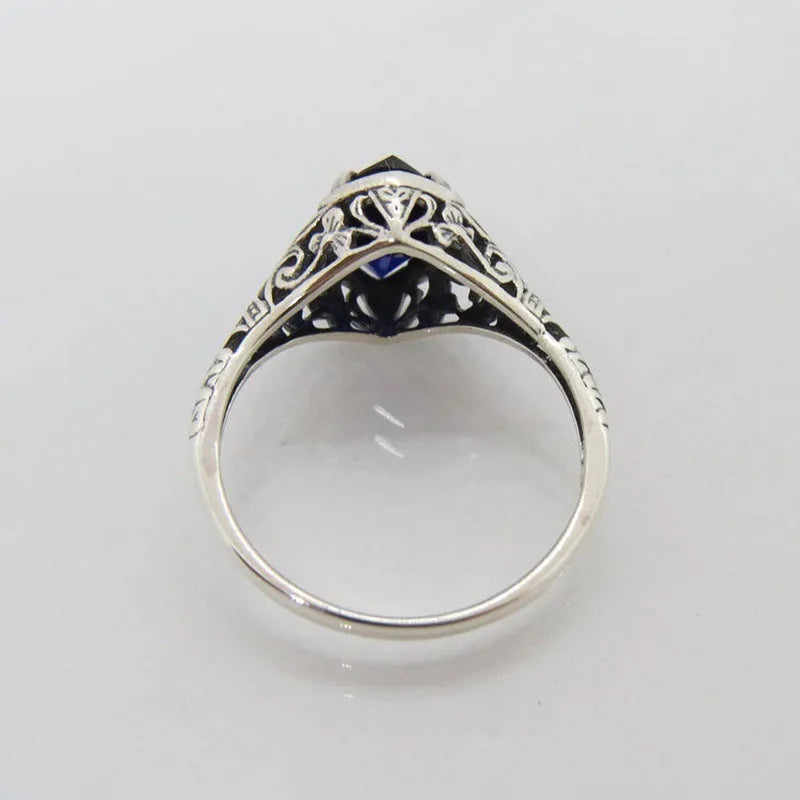 Silver women's geometric hollow ring with zircon accents on alloy band