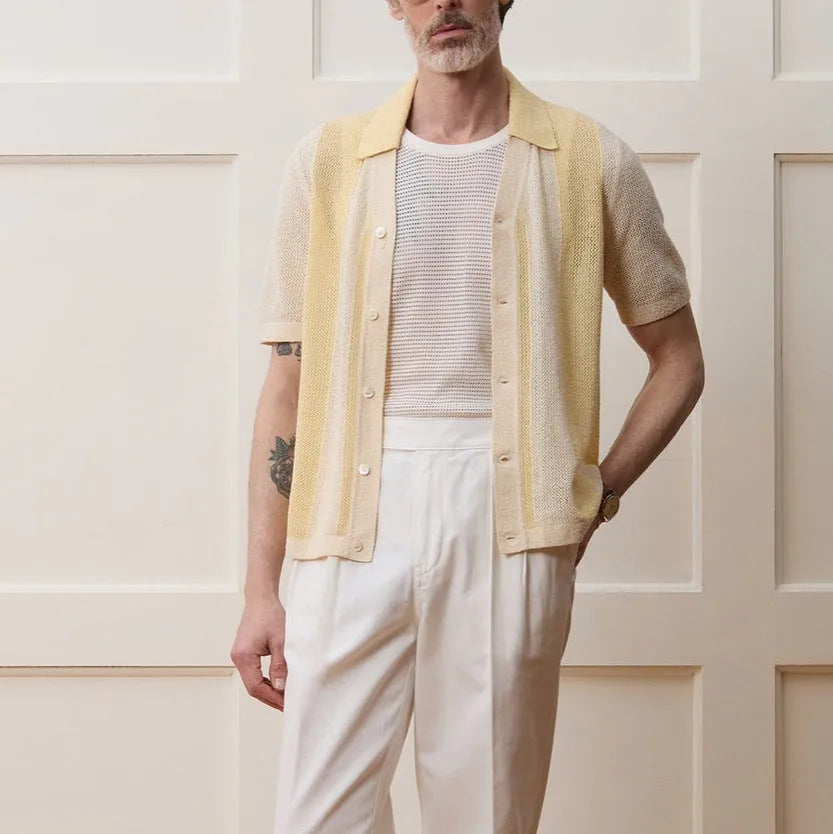 Yellow men's casual polo shirt with asymmetric design and short sleeves made from Tencel fabric.