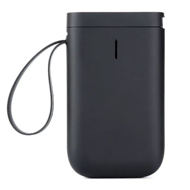 D11 compact white Bluetooth thermal label printer with USB cable and roll of label paper on a desk.