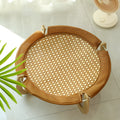 Brown woven rattan pet hammock bed for cats and small dogs on a white floor