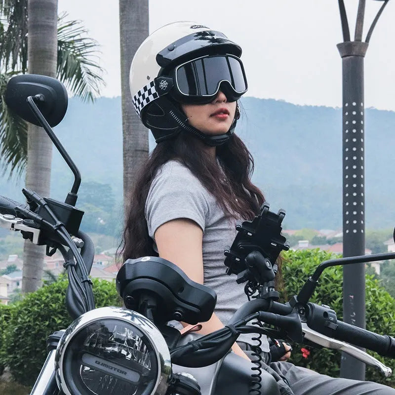 Retro style motorcycle helmet shown in cement grey colour on a solid background