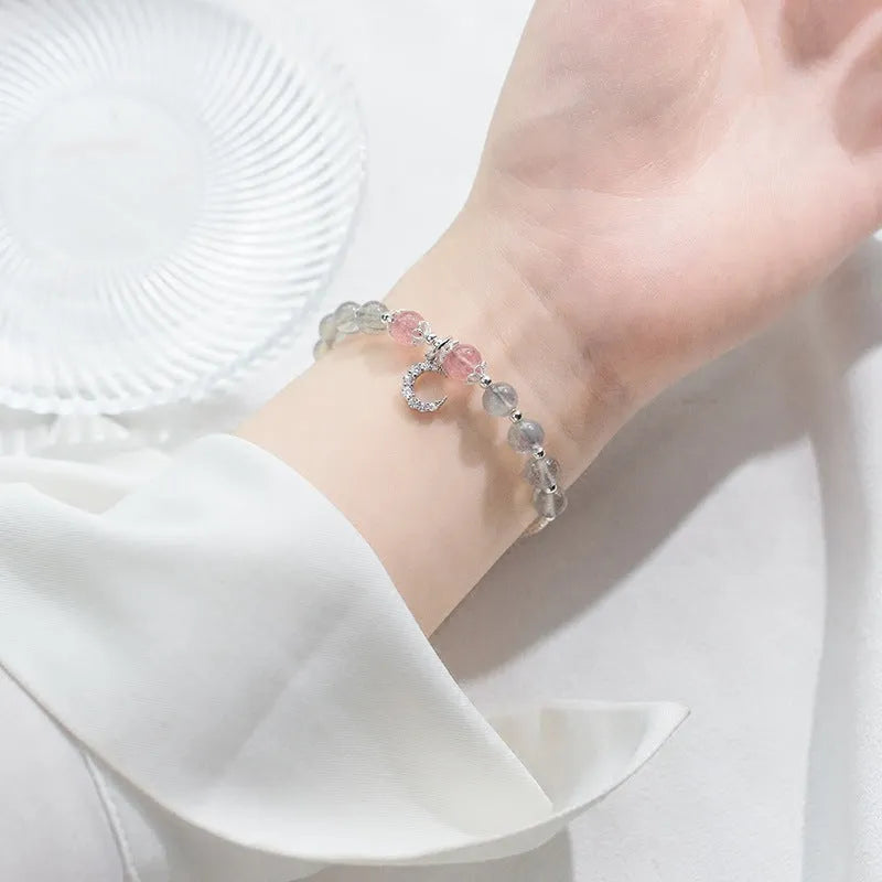 Moonstone handmade bracelet with crescent moon charm and adjustable extension chain.