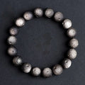 Obsidian crater ball bracelet with natural grinding texture in silver stone meteorite colour