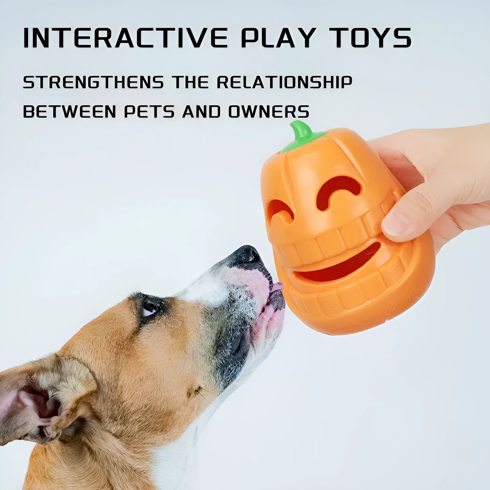 Orange Halloween pumpkin shaped interactive dog chew toy with treat-dispensing funnel.