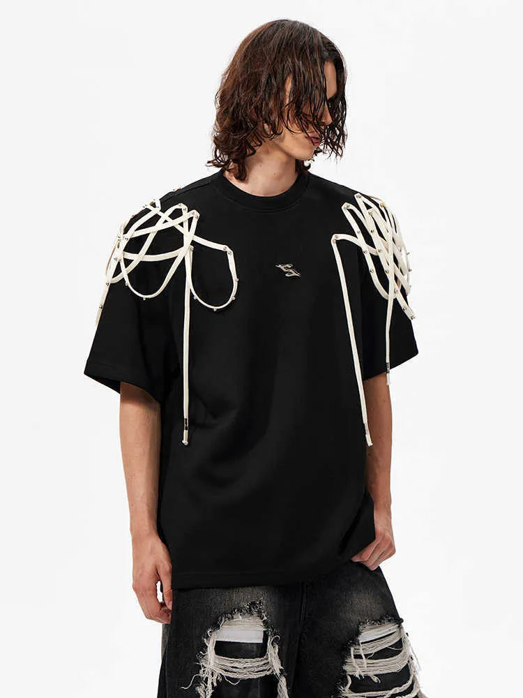 Black women's t-shirt with decorative ribbon trim padded shoulders and rivet detailing