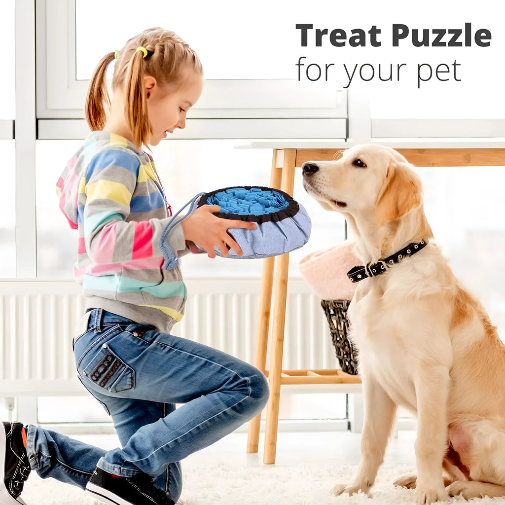 Blue adjustable cotton snuffle mat for dogs with non-slip backing on a wooden floor.