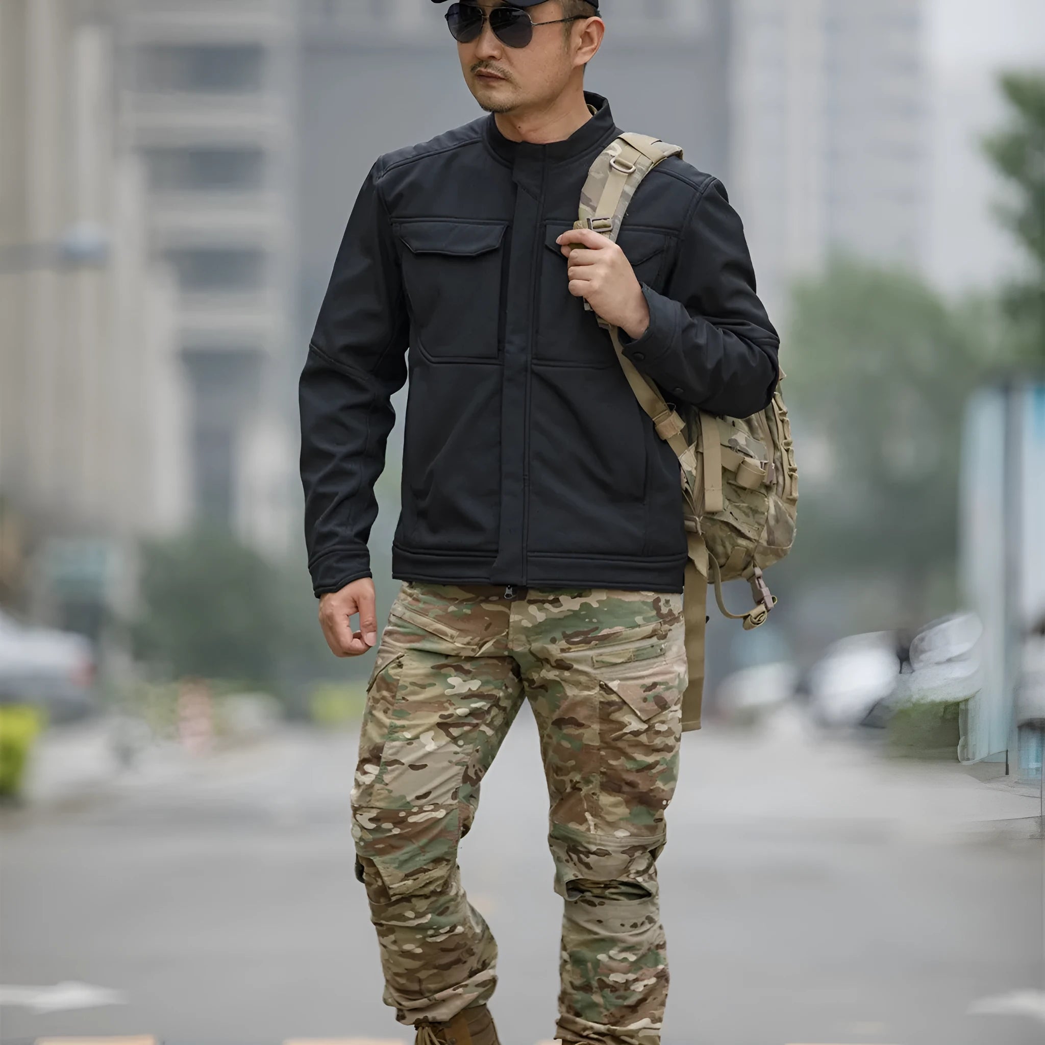 Bone Frog Peak Breaker black soft shell tactical jacket shown on model for mountaineering.