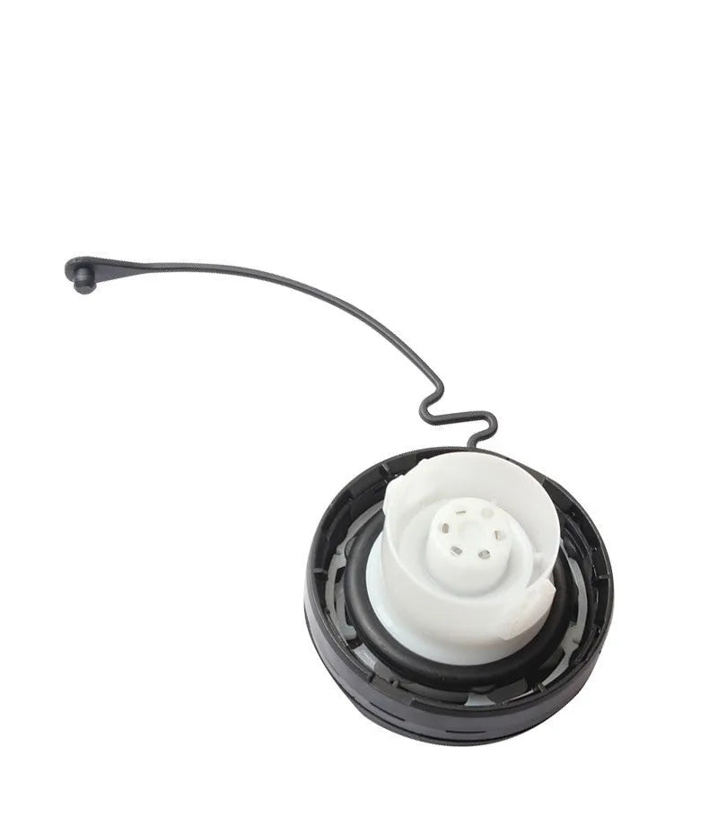 Snap-type fuel tank cap replacement part for Toyota vehicles.