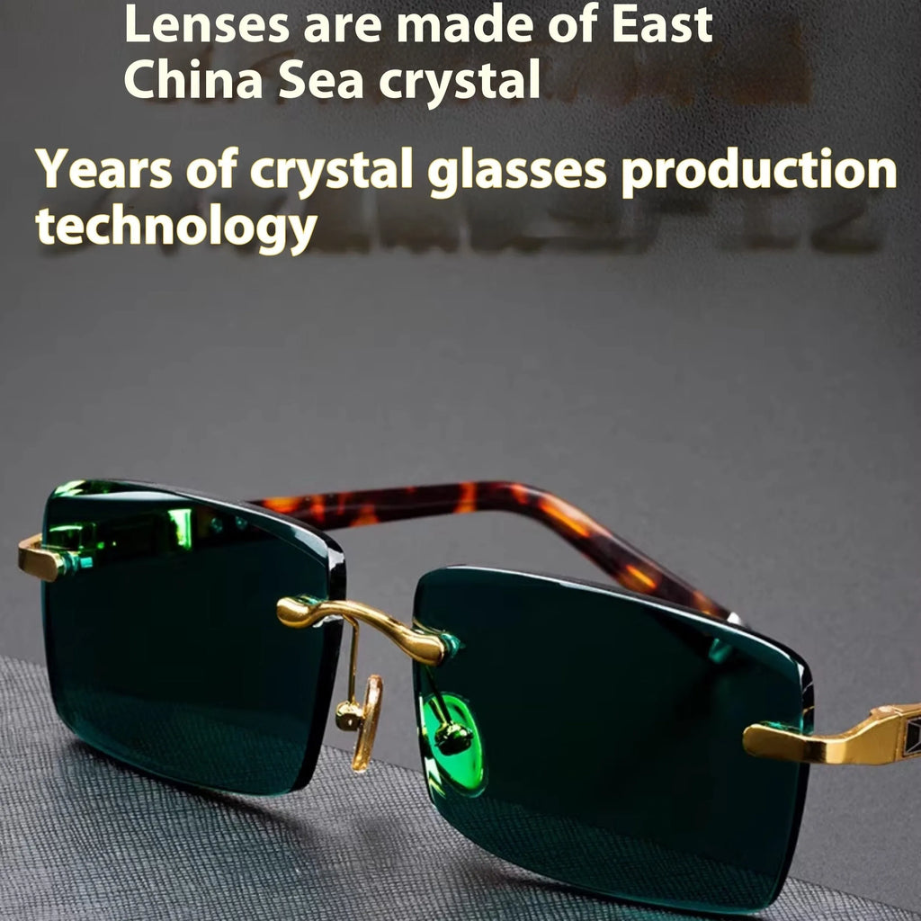 Dark green frameless crystal sunglasses inside a hard case with a cleaning cloth.