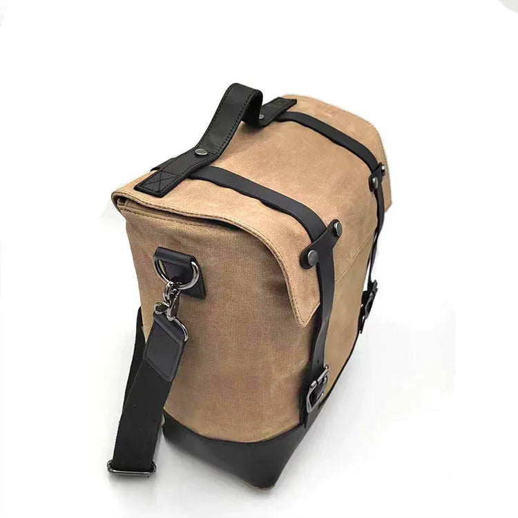 Waterproof canvas motorcycle side pannier bag with cowhide reinforcement in black colour