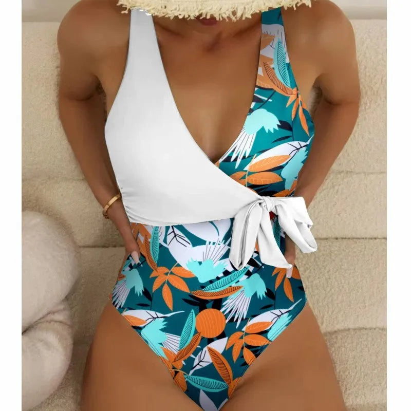 Women's high-waist one-piece swimsuit in a printed pattern, showing conservative cut and style.