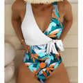 Women's high-waist one-piece swimsuit in a printed pattern, showing conservative cut and style.