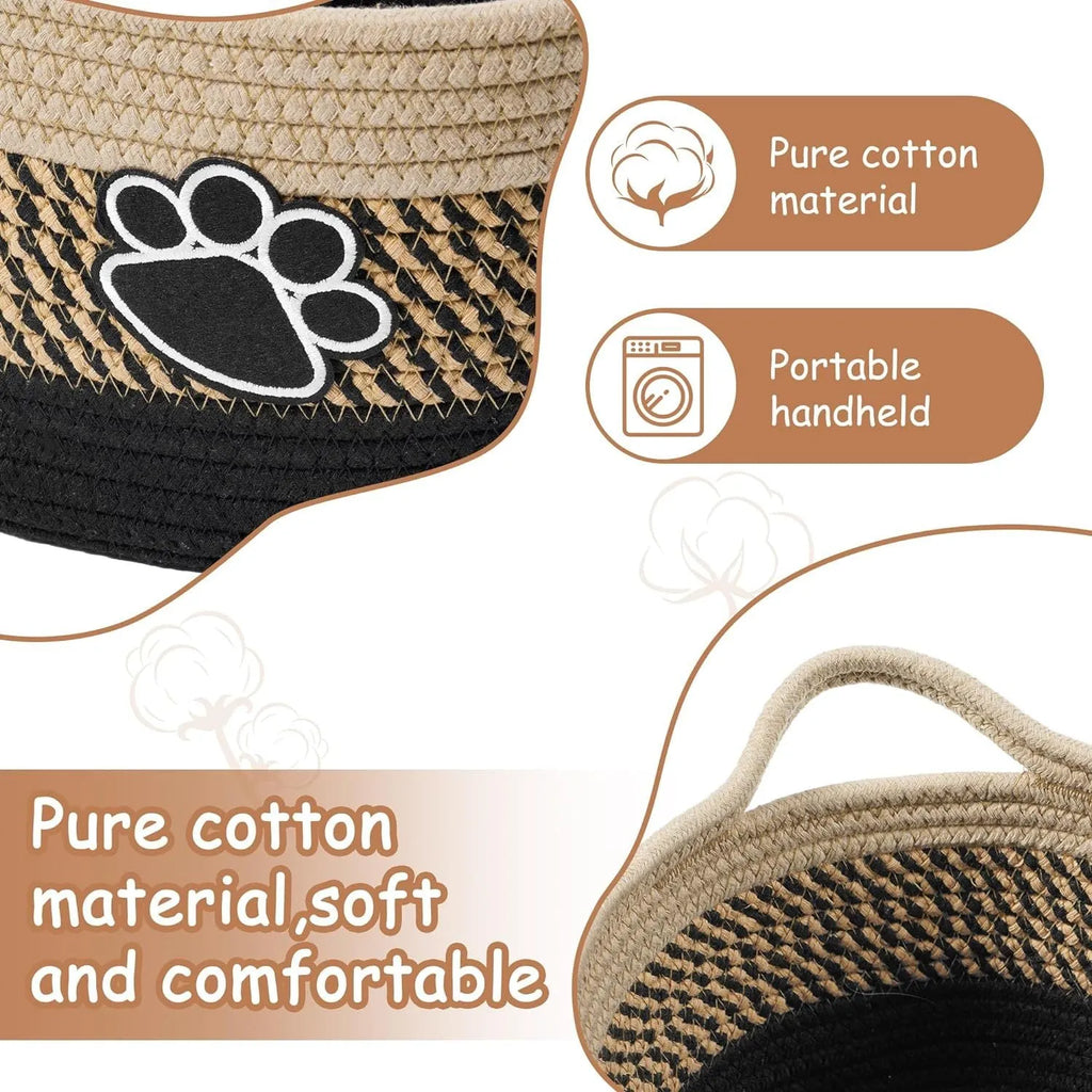 Light beige handmade woven cotton rope storage basket with wood accents and a handle.