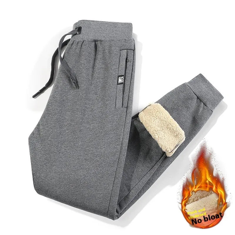 Men's fleece-lined track pants in grey or black with elastic mid-waist and plus-size fit options