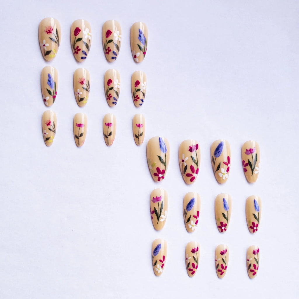 Almond-shaped removable nail art with floral patterns including roses and tulips