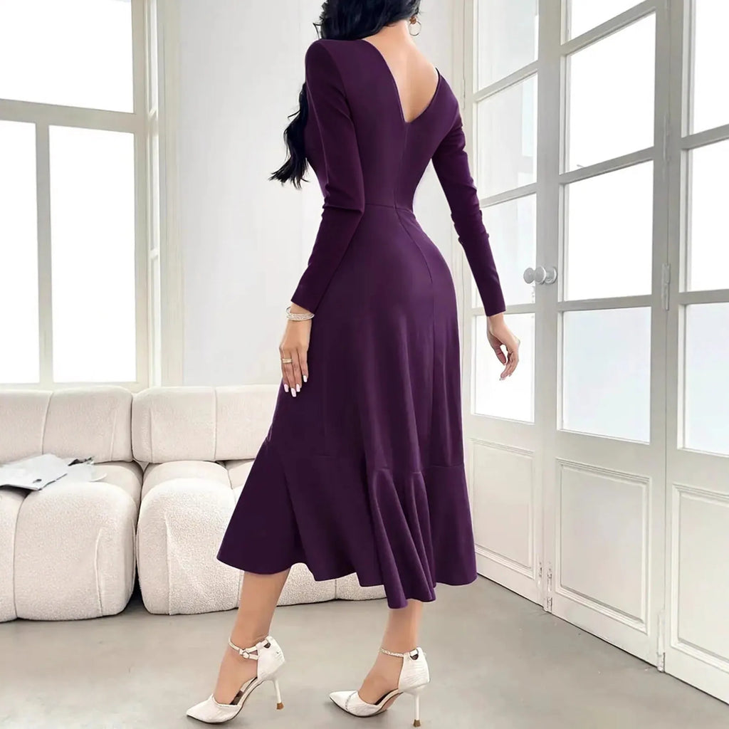 Purple women's long sleeve dress with round neck and ruffle details on a hanger.