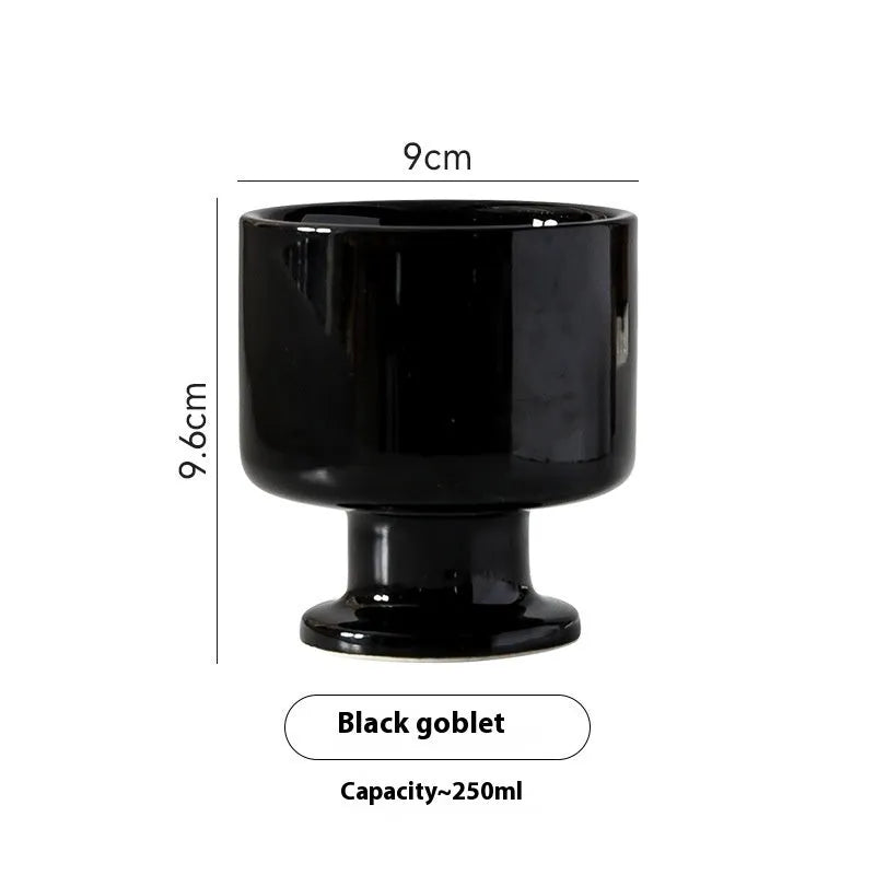 Hand-pinched irregular ceramic mug in a solid colour, shown from the side to display its unique shape.