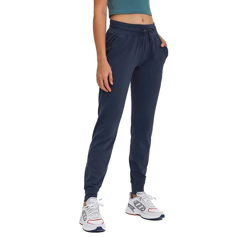 Women's high waist yoga pants with drawstring in Belgian Blue, black, and grey colors for fitness and running