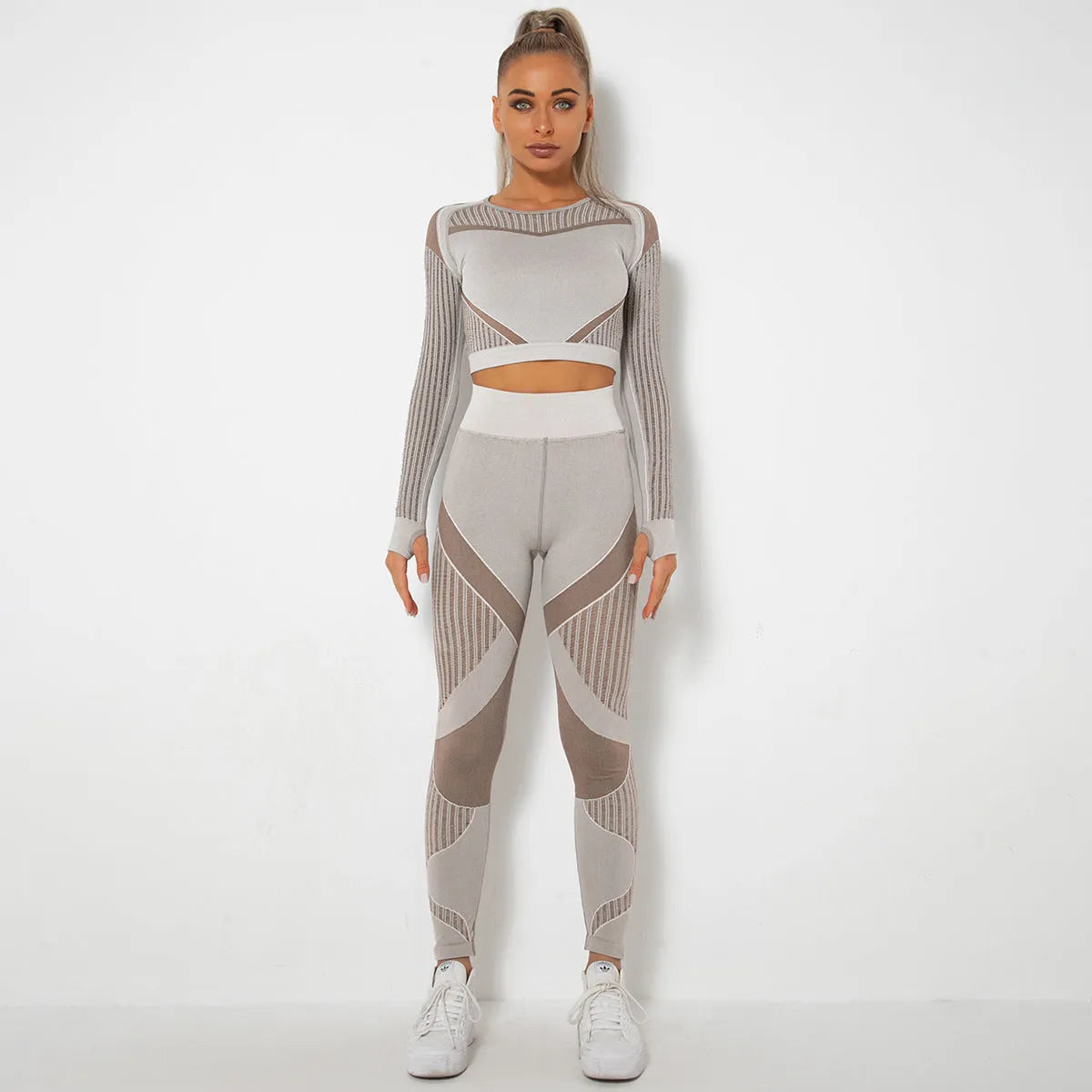 Women's long-sleeved seamless knitted yoga suit in a breathable fabric blend.