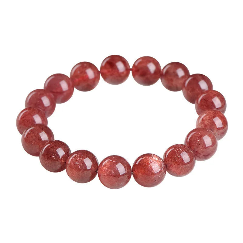 Natural strawberry quartz bracelet with geometric cherry red beads showing a starlight sparkle.