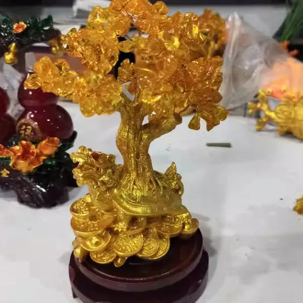 Citrine-coloured small water turtle money tree Feng Shui ornament made of resin.