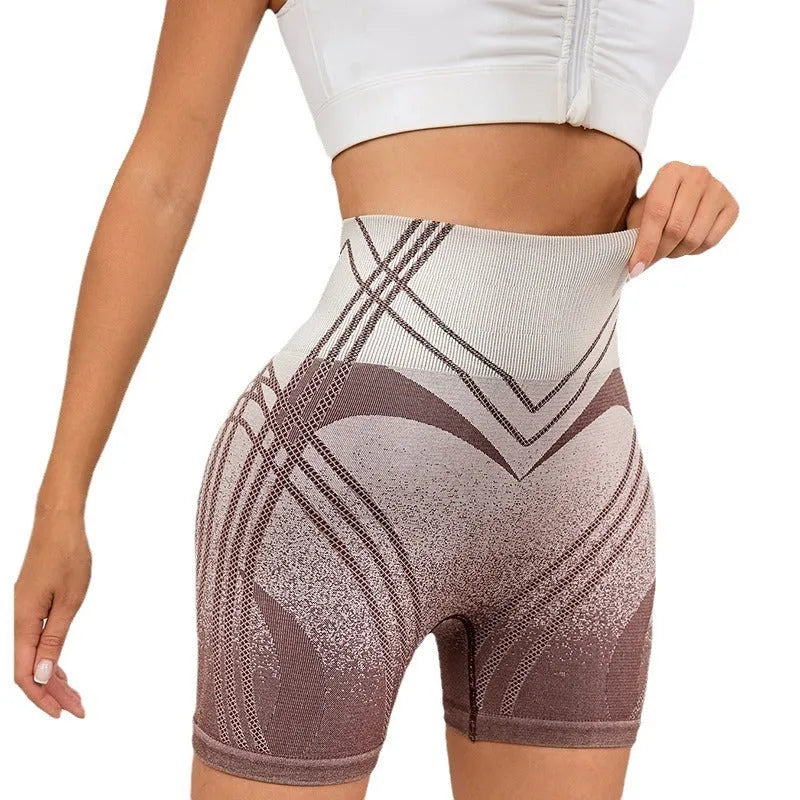 Women's brown gradient high waisted fitness shorts laid flat, showing nylon blend lining.