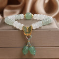 Green abacus bead bracelet for women with a butterfly tassel, pearls, and rhinestones