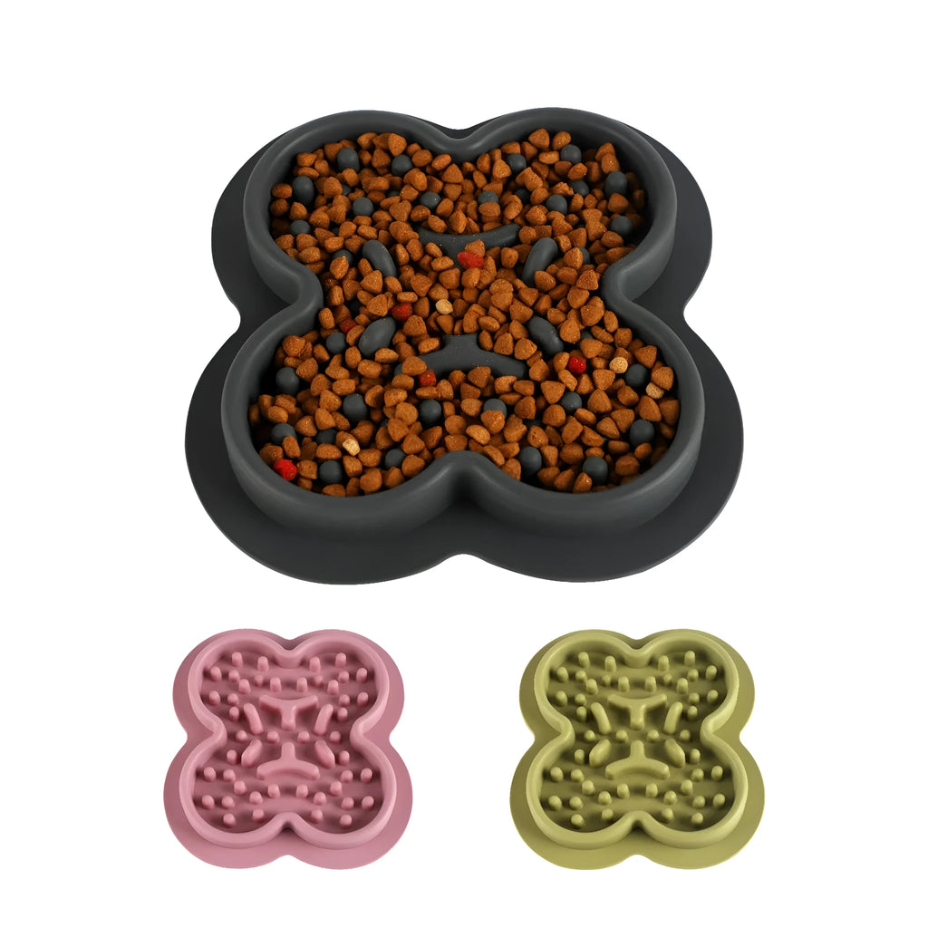 Silicone pet licking pad slow feeder mat in various colours on a floor