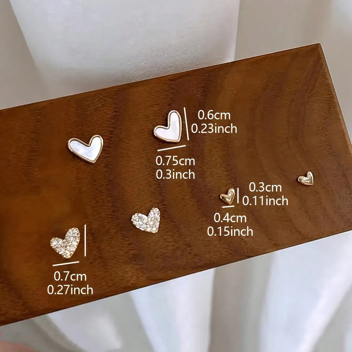 Women's fashion heart earrings set with 3 pairs in gold, black, and pink alloy electroplated colours