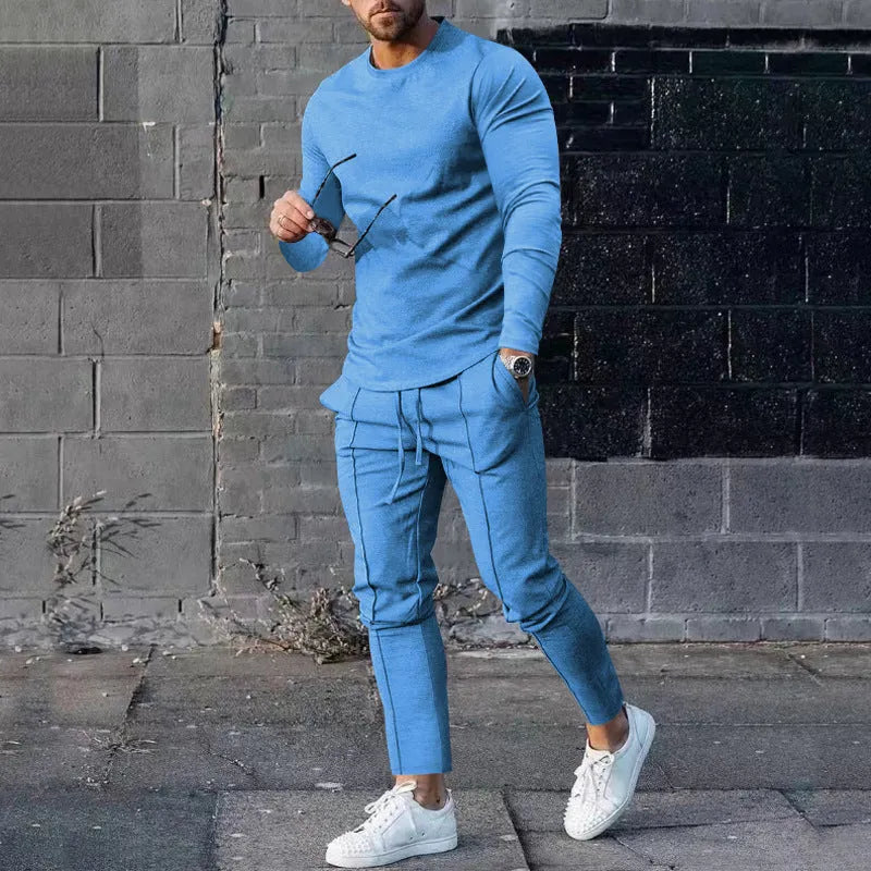 Men's light grey polyester two-piece suit with long sleeve round-neck t-shirt and matching trousers