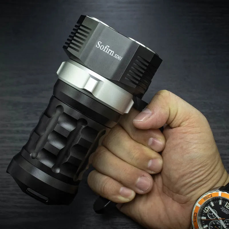 Aluminium alloy diving tube flashlight, 18cm long, shown in hand for scale.