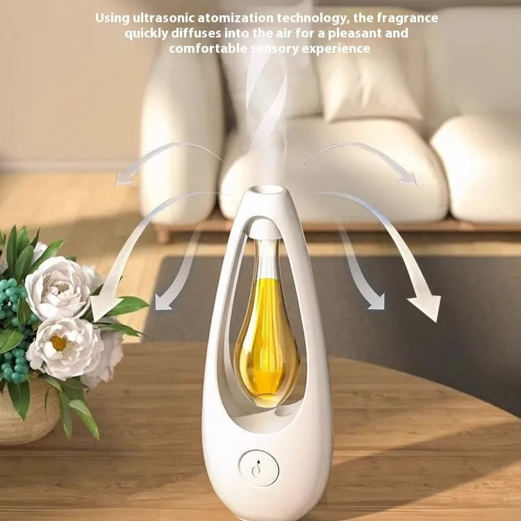 White ultrasonic essential oil diffuser with remote control on a wooden table