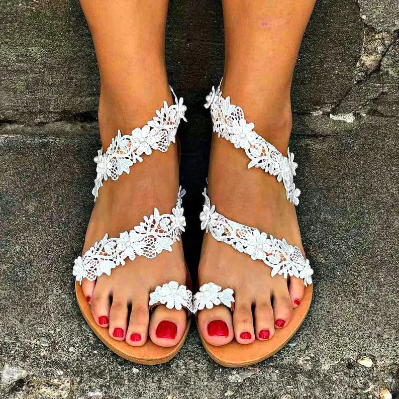 White women's sandals with floral rhinestone decoration and round toe design